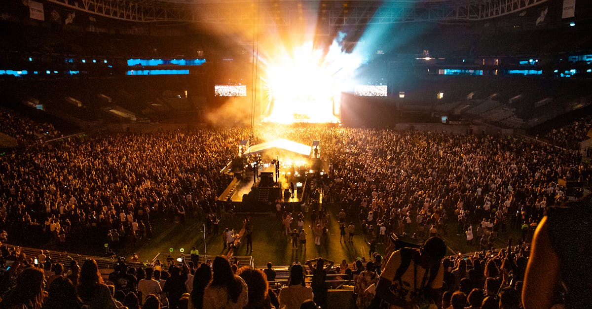 Lively concert atmosphere captures the energy of a packed crowd in a São Paulo stadium at night.